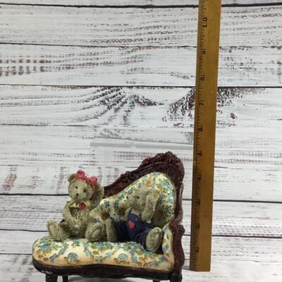 Floral antique couch with two bears figurines