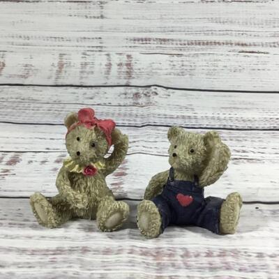 Floral antique couch with two bears figurines