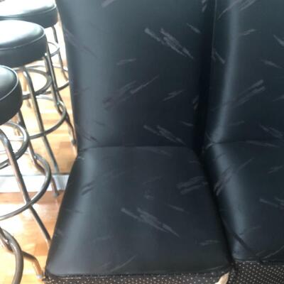 Four solid wood high back covered chairs