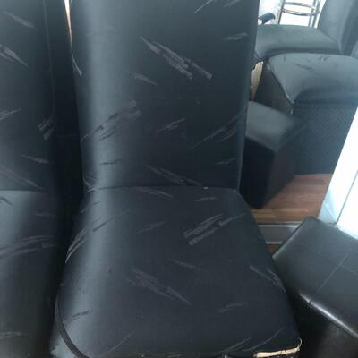 Four solid wood high back covered chairs
