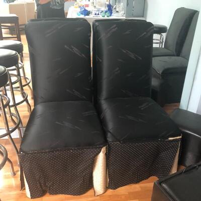 Four solid wood high back covered chairs
