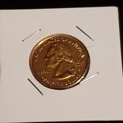 Bu 1999 Gold plated quater 