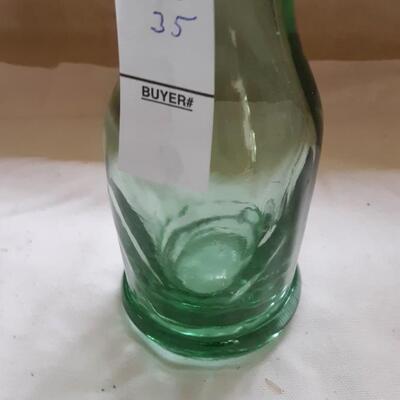 Lot 35 - Tilted Glass Soda Bottle