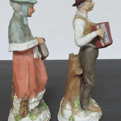 Pair of Large Man and Lady Figurines