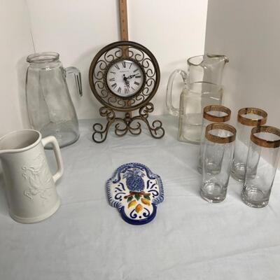 Clock, 3 pitchers, 4 hi ball glasses, Welcome sign