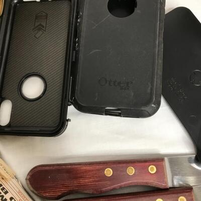 2 speakers,door knobs, 8 steak knives,4 phone cases,2 brass door knobs, caddy for remotes