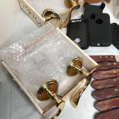 2 speakers,door knobs, 8 steak knives,4 phone cases,2 brass door knobs, caddy for remotes