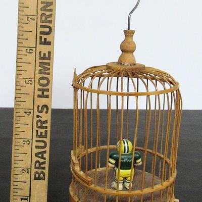Birdcage With Tiny Packer's Figurine Inside