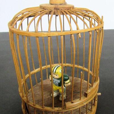 Birdcage With Tiny Packer's Figurine Inside