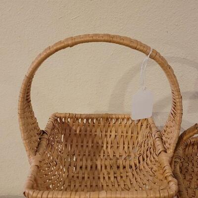 Lot 247: (2) Raffia Baskets and (1) Large Basket with Leather Handles