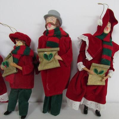 4 Plastic and Cloth Christmas Carolers