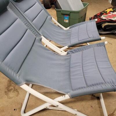 2 blue folding chairs