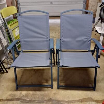 2 blue folding chairs