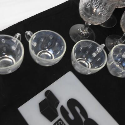 14 pc Crystal.  8 cups, 2 serving plates, 1 Pitcher and 3 wine glasses