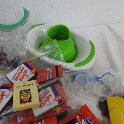 Kitchen items: knives, canning funnel, chip clips, matches, nut cracker, magnets