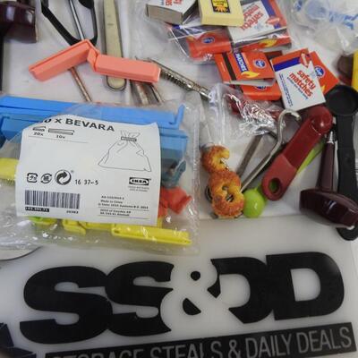 Kitchen items: knives, canning funnel, chip clips, matches, nut cracker, magnets