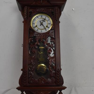 Wood  32 in tall working Grandfather clock w/key, hanging, mahogany colored wood