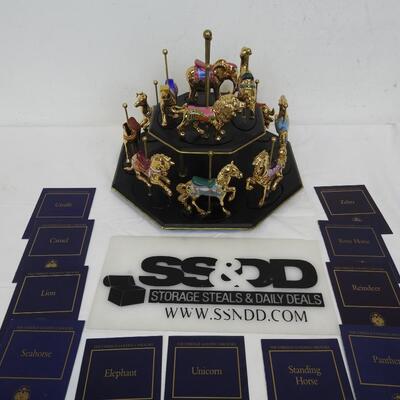 11 Pc Faberge Golden Carousel Includes 2 Tier Base. Some items are broken.