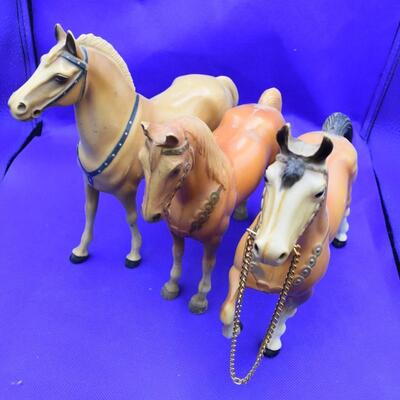 2 orange and 1 white horse