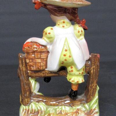 Cute Girl on Fence Figurine
