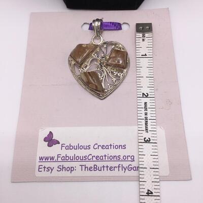 LOTJ139: Honey-Brown Rhodochrosite in Heart-Shaped Silver Pendant