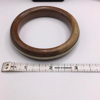 LOTJ158: Four Costume Bracelets - Metal, Wood, Plastic