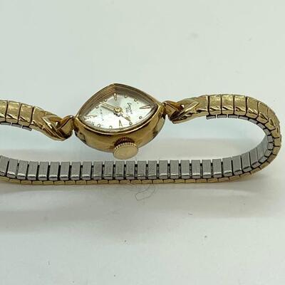 LOT:13: Antique Germinal Voltaire 17 Jewel Ladyâ€™S Gold-tone stretch band Wristwatch