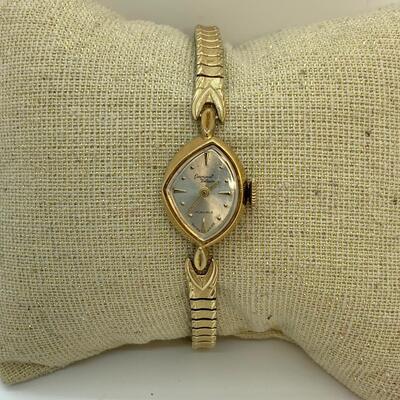 LOT:13: Antique Germinal Voltaire 17 Jewel Ladyâ€™S Gold-tone stretch band Wristwatch