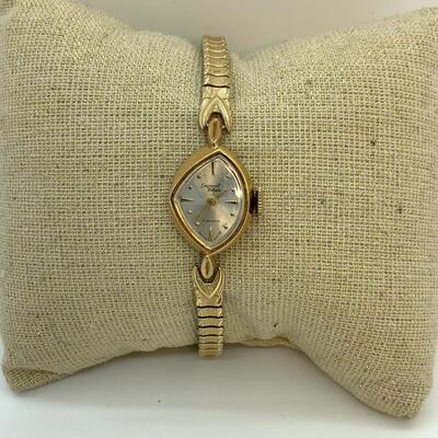 LOT:13: Antique Germinal Voltaire 17 Jewel Ladyâ€™S Gold-tone stretch band Wristwatch