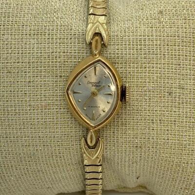 LOT:13: Antique Germinal Voltaire 17 Jewel Ladyâ€™S Gold-tone stretch band Wristwatch