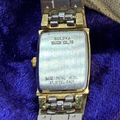 LOT:17: Bulova Gold tone Stainless Steel Black face Quartz Watch