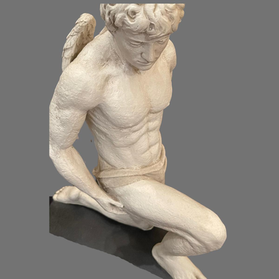 Large Kneeling Cupid Statue on Display Board