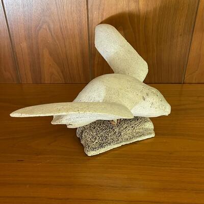 Bleached whale bone seagull carving