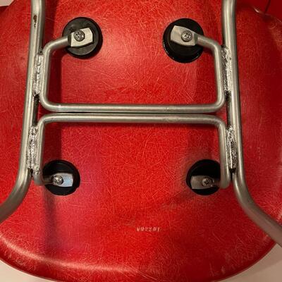 4 red Herman Miller molded plastic chairs