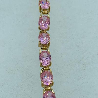 LOT 55: Pink Gemstone 7" 14K Gold Tennis Bracelet - 11 gtw
