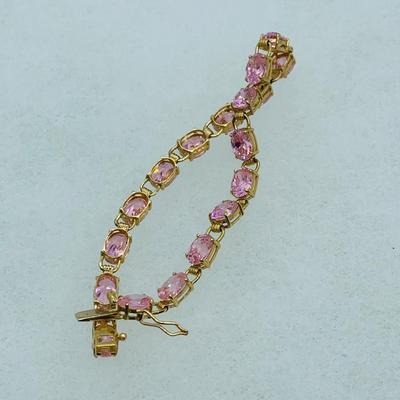 LOT 55: Pink Gemstone 7" 14K Gold Tennis Bracelet - 11 gtw
