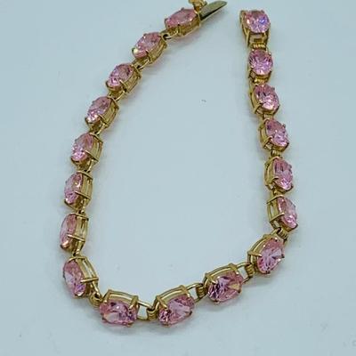 LOT 55: Pink Gemstone 7" 14K Gold Tennis Bracelet - 11 gtw
