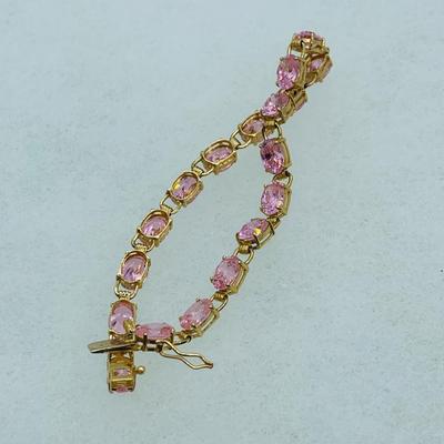 LOT 55: Pink Gemstone 7" 14K Gold Tennis Bracelet - 11 gtw