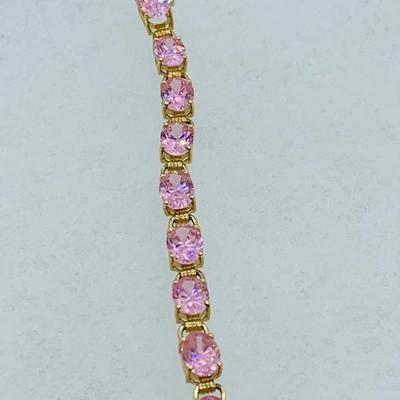 LOT 55: Pink Gemstone 7" 14K Gold Tennis Bracelet - 11 gtw