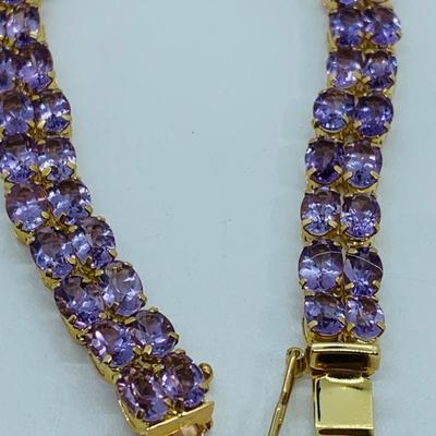 LOT 56: - 11.66g tw 14K ODI Yellow Gold 7" Amethyst Bracelet - Double Row