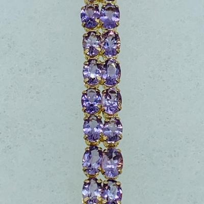 LOT 56: - 11.66g tw 14K ODI Yellow Gold 7" Amethyst Bracelet - Double Row