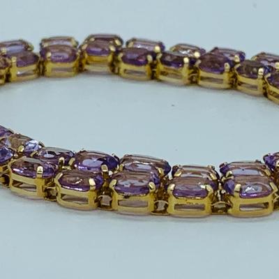 LOT 56: - 11.66g tw 14K ODI Yellow Gold 7" Amethyst Bracelet - Double Row