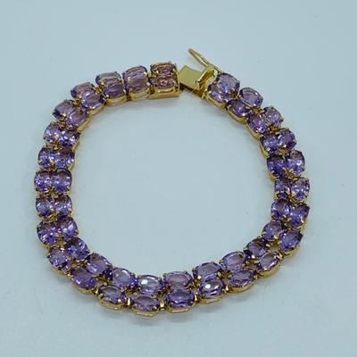 LOT 56: - 11.66g tw 14K ODI Yellow Gold 7" Amethyst Bracelet - Double Row