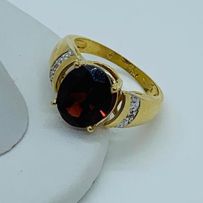 LOT 82: 14K Gold Garnet & Diamond Chip Size 7 Ring - 5 gtw