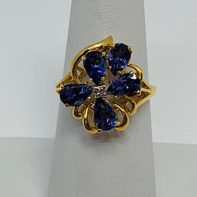 LOT 88: 3.35g tw 14K Gold Tanzanite Cluster ring w/ Diamond Center - Size 7.5
