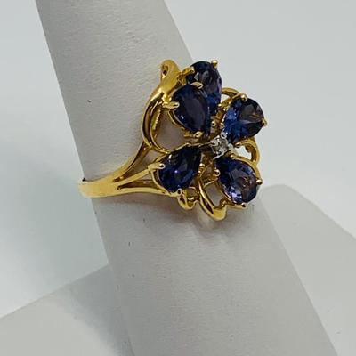 LOT 88: 3.35g tw 14K Gold Tanzanite Cluster ring w/ Diamond Center - Size 7.5