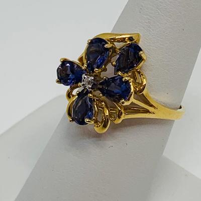 LOT 88: 3.35g tw 14K Gold Tanzanite Cluster ring w/ Diamond Center - Size 7.5