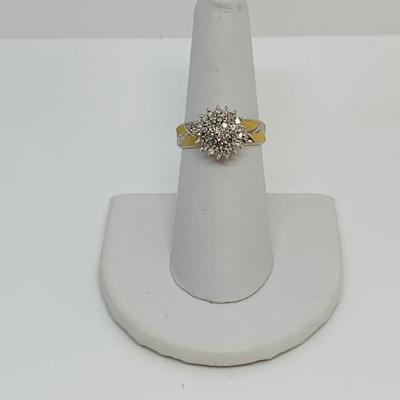 LOT 115: - 4.23g tw 10K EV 21 Diamond Cluster Ring -  two tone band - Size 7