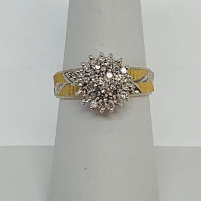 LOT 115: - 4.23g tw 10K EV 21 Diamond Cluster Ring -  two tone band - Size 7