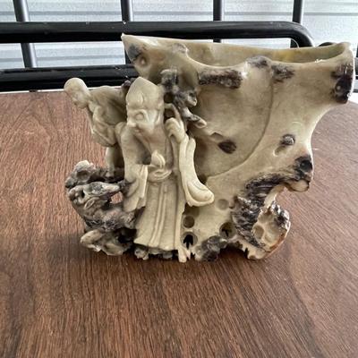 Asian stone carving - tending to the flock